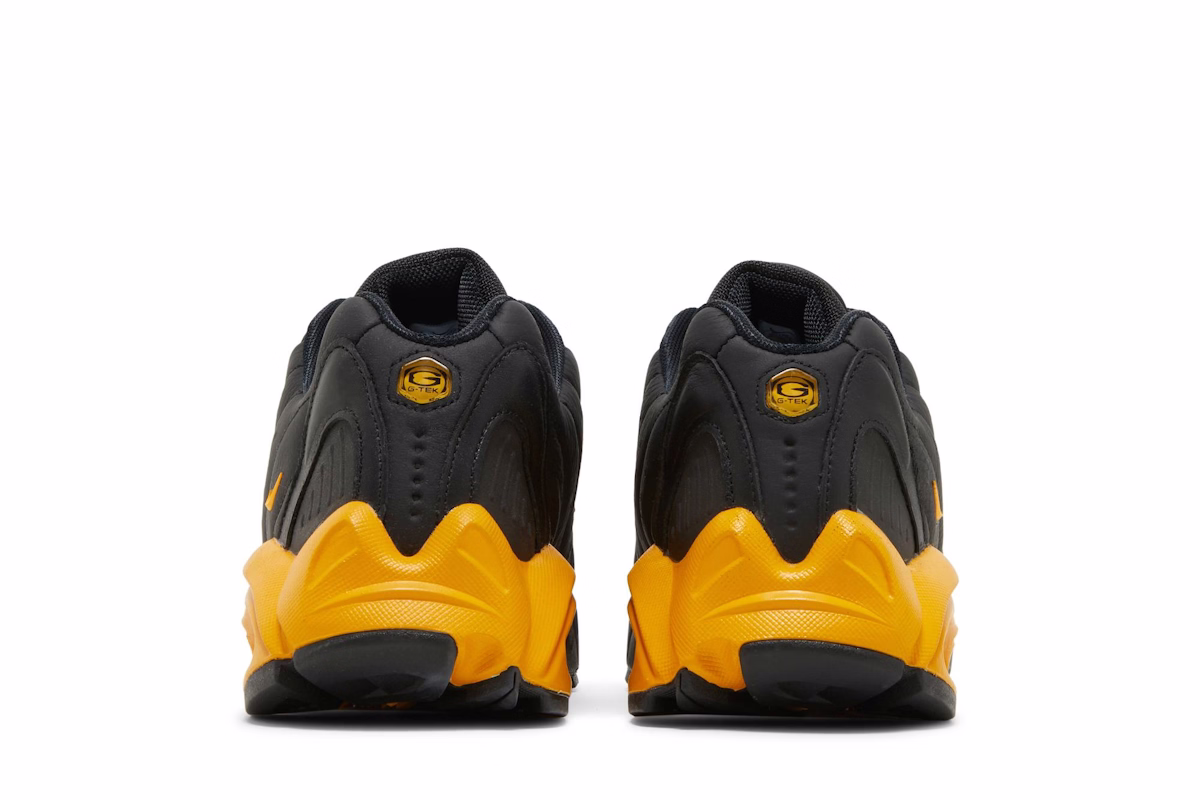 NOCTA x Nike Hot Step Air Terra 'Black University Gold'