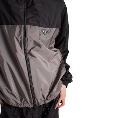 PRADA FW24 Loose Fit Hooded Jacket with Logo Patch in Iron Gray. SGC601-1WQ9-F0N5A-S-BOO Details for PRADA FW24 Loose Fit Hooded Jacket with Logo Patch in Iron Gray. SGC601-1WQ9-F0N5A-S-BOO