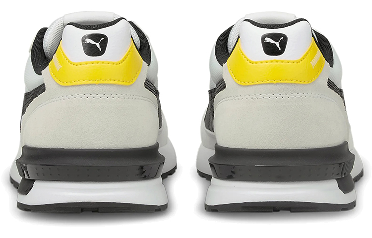 Shop Puma Graviton Pro 低幫跑步鞋 白黑黄