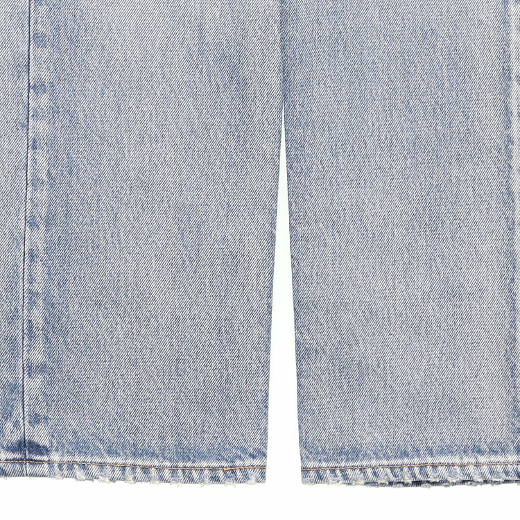 Sizing Saint Laurent Distressed Washed Logo Denim Jeans in Blue. 597052YM3724568
