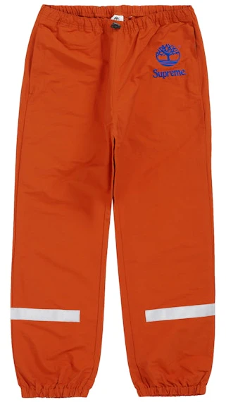 supreme-timberland-reflective-taping-track-pant-rust