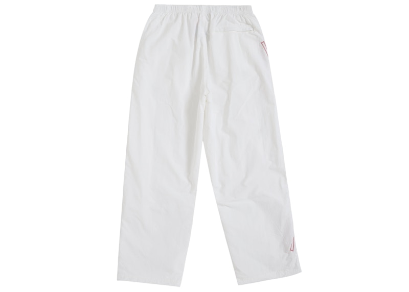 Lookbook Supreme Spellout Embroidered Track Pant (SS25) Warna Gading.