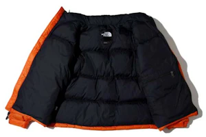 Shop The North Face 1996 復古羽絨外套 橘色 男女款 可收納保暖外套。 NJ1DK50G