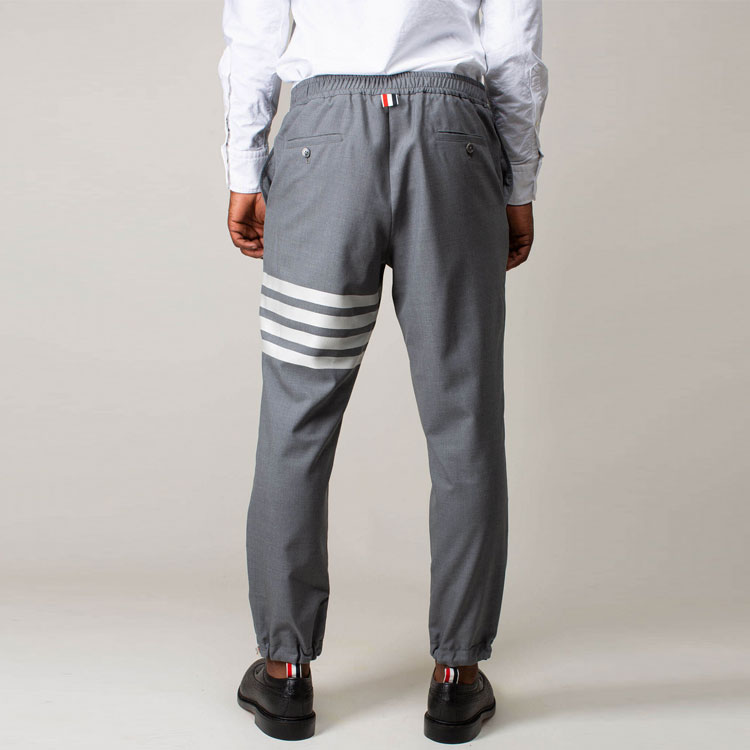 Sizing Thom Browne Pantalones Jogger de Punto Gris con Cuatro Barras Clásicas. MTT030A-06146-035