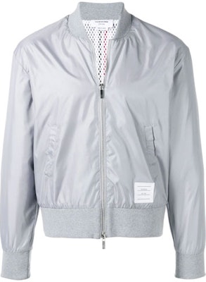 Thom Browne Jaket Bomber Lengan Panjang Silver dengan Detail Garis Belakang. MJT171A-03215-055 Buy Thom Browne Jaket Bomber Lengan Panjang Silver dengan Detail Garis Belakang. MJT171A-03215-055