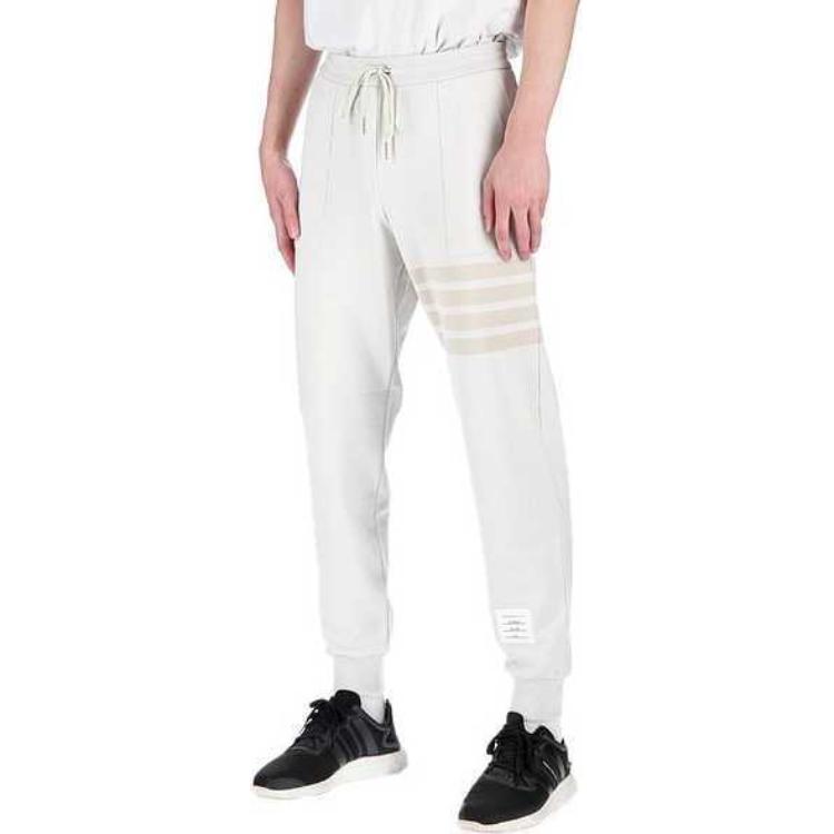 Shop Pantalones de Punto Blancos Naturales Thom Browne FW23 con Diseño de Cuatro Rayas. MJQ177A-06910-113