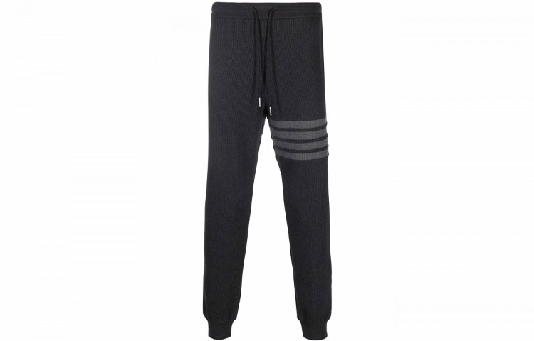 THOM BROWNE FW23 Grey Four-Bar Waffle Knit Joggers Carbon Gray. MJQ082A-06452-015