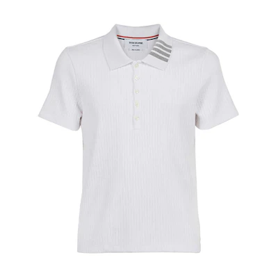Thom Browne Relaxed Fit Polo Shirt with Four-Stripe Collar. MJP116A-07063-100