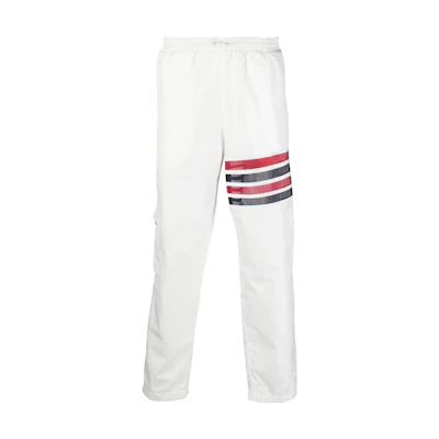 Thom Browne SS23 White Lightweight 4-Bar Track Pants with Self-Packable Design. MJQ163A-F0197-100