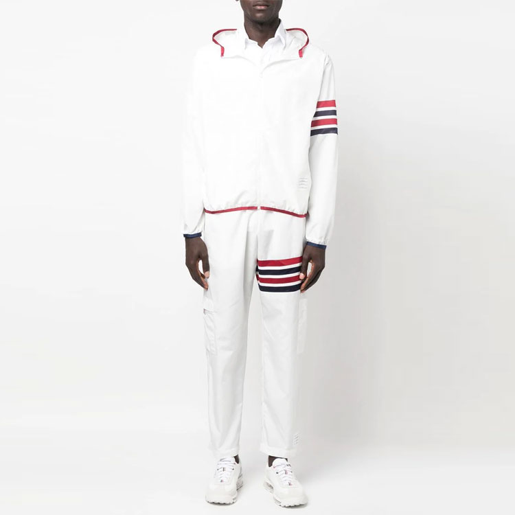 Lookbook Thom Browne SS23  White Lightweight 4-Bar Track Pants with Self-Packable Design. MJQ163A-F0197-100
