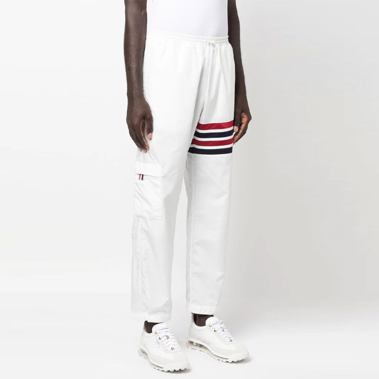 Purchase Thom Browne SS23  White Lightweight 4-Bar Track Pants with Self-Packable Design. MJQ163A-F0197-100