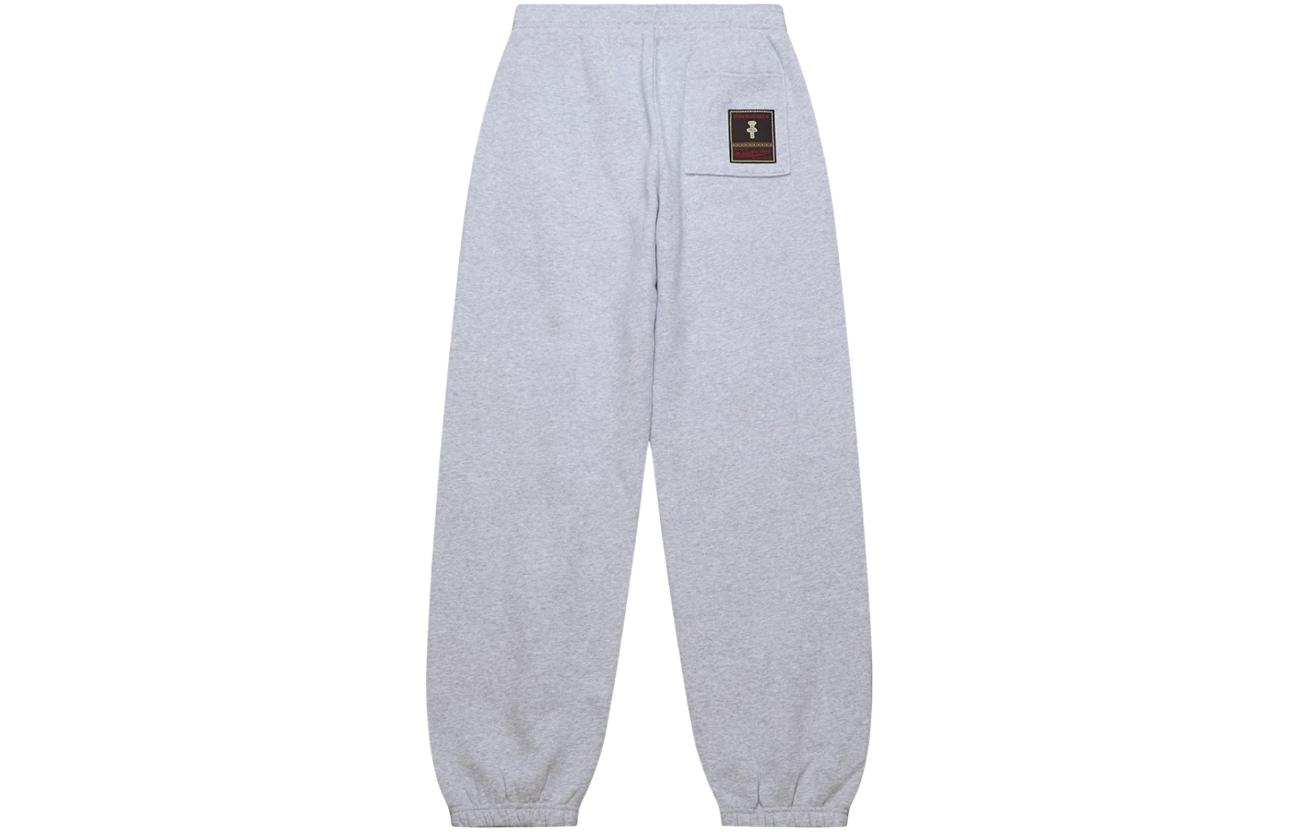 Lookbook Travis Scott x Mitchell & Ness Pantalones Jogger LSU SS24 Unisex Grises. BT9328-LSUGYHT