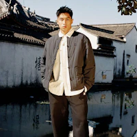 Shop UNDEFEATED 蛇年限定新年膠囊系列黑色外套 男女款 UC44GPJ06M