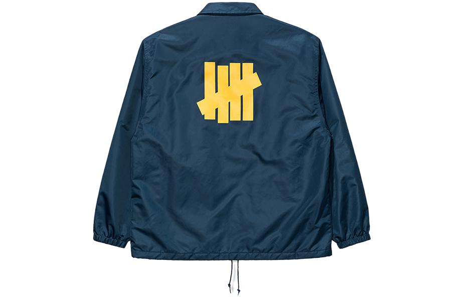 Lookbook UNDEFEATED FW23 海軍藍條紋拼接Logo教練外套 男女款. UC33GWJ05M