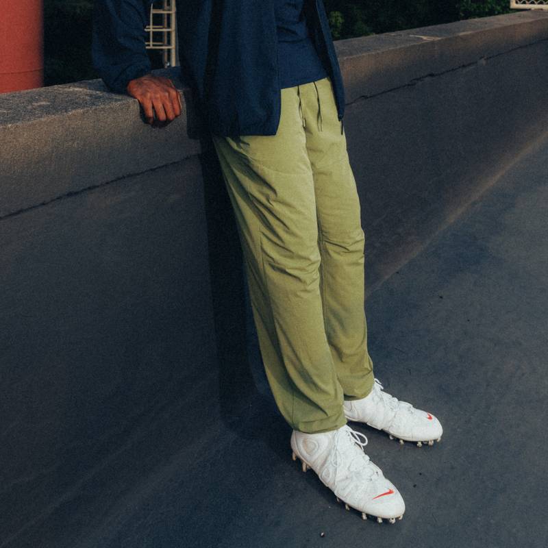 Shop UNDEFEATED Relaxed Fit Logo Track Pants with Elastic Waist and Zipper Pockets. UP41GWP01M