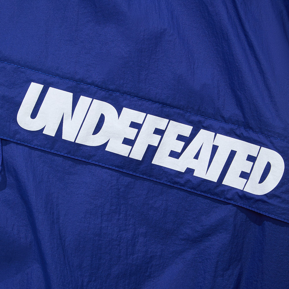 Purchase UNDEFEATED SS25 条纹标志轻便夹克 男女复古款式. UC52GWJ02M