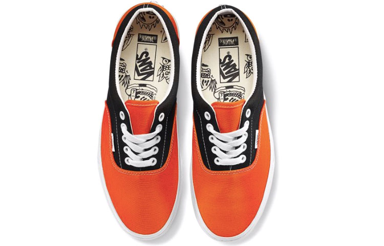 Shop Vans Era 骷髅印花复古休闲帆布鞋 黑橙拼色 'Black Orange' VN0A38FRT5M