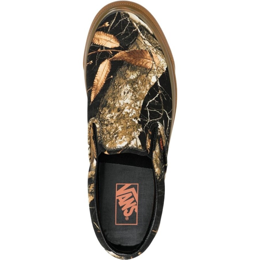 Purchase Vans Realtree Classic Slip-On 'Hitam Gum' VN0A7Q580QR