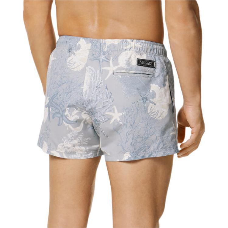 Shop VERSACE La Vacanza Holiday SS24 Bañador Estrella y Concha Marina Azul. 1016217-1A11347-5E360