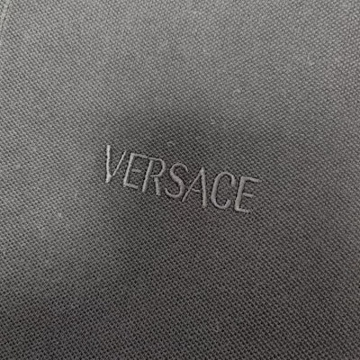 VERSACE SS23 Black Polo Shirt with Letter Embroidery Casual Style. 1012260-1A08837-2B130 Details for VERSACE SS23 Black Polo Shirt with Letter Embroidery Casual Style. 1012260-1A08837-2B130
