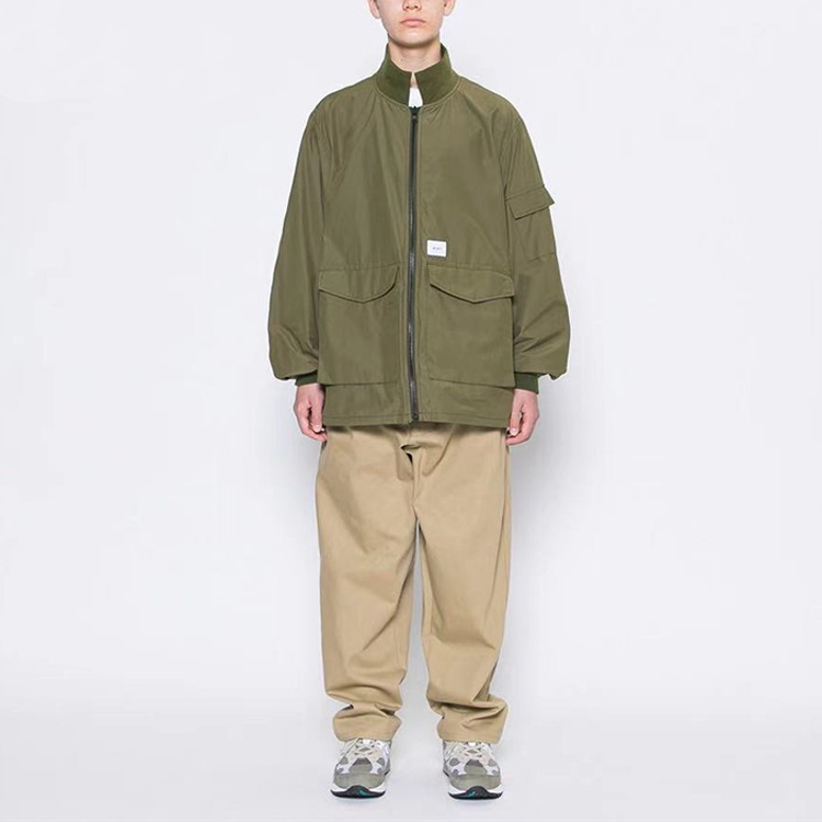Shop WTAPS Military Green Loose-Fit Stand Collar Jacket with Large Pockets. 202TQDT-JKM01
