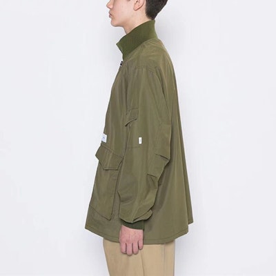WTAPS Military Green Loose-Fit Stand Collar Jacket with Large Pockets. 202TQDT-JKM01 Details for WTAPS Military Green Loose-Fit Stand Collar Jacket with Large Pockets. 202TQDT-JKM01