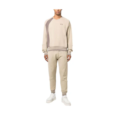 Y-3 FW22 Beige Tapered Track Pants with Solid Logo Print for Men. HT2350